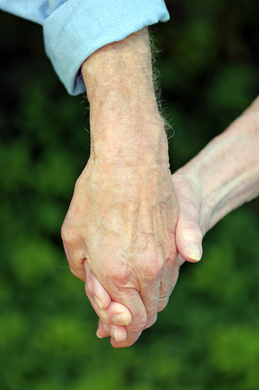 Seniors holding hands